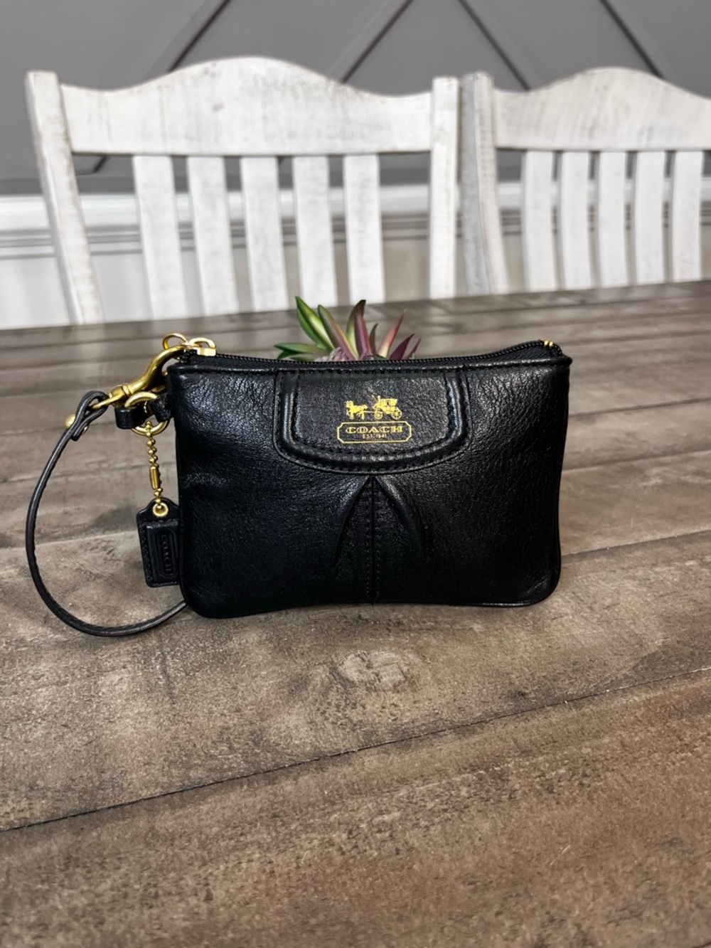 Madison black pebbled leather wristlet featuring gold-tone hardware - Picture 2 of 5